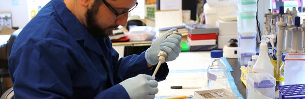 student pipetting